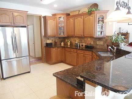 Spacious Kitchen : Granite counters, stainless-steel appliances, pantry, dinette and storage closet