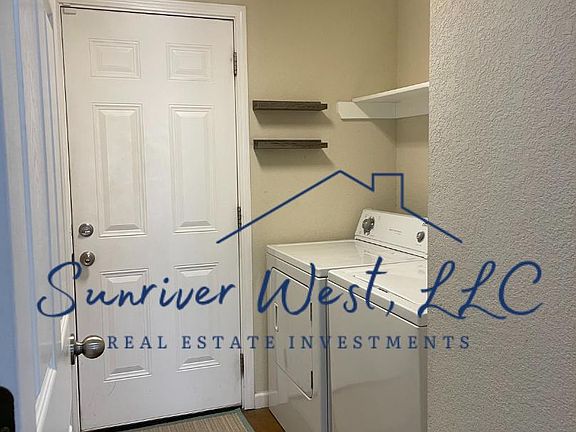 Laundry room leads to garage; appliances are a courtesy.