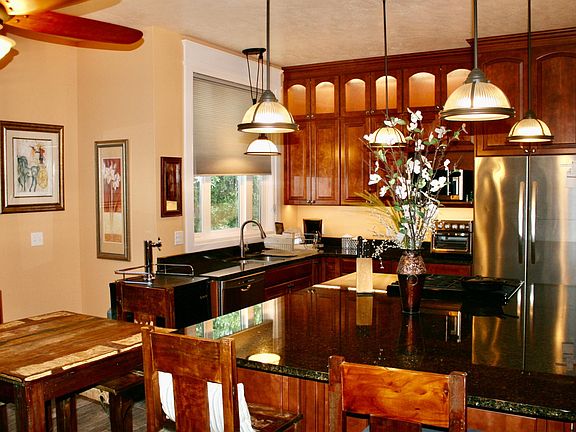 Chefs kitchen with granite countertops.