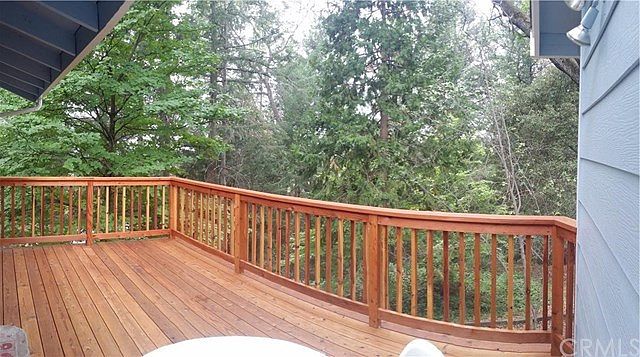 Brand new deck overlooking private, forested back yard.