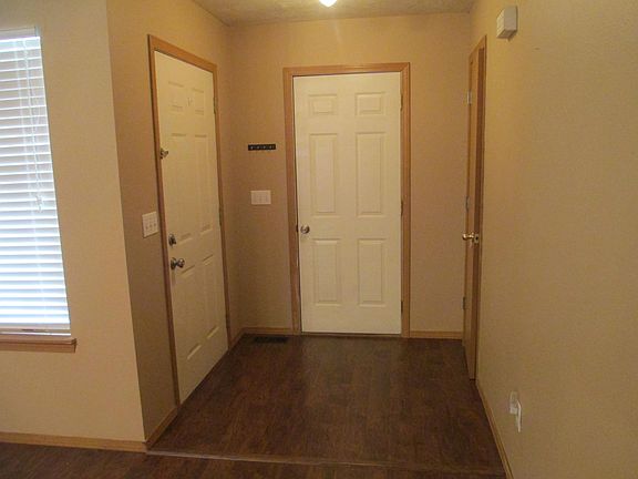 Entry on left, coat closet on right, and garage at back
