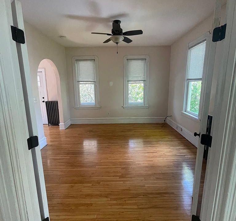 Primary bedroom opens to the living room space and has large closet and office nook.