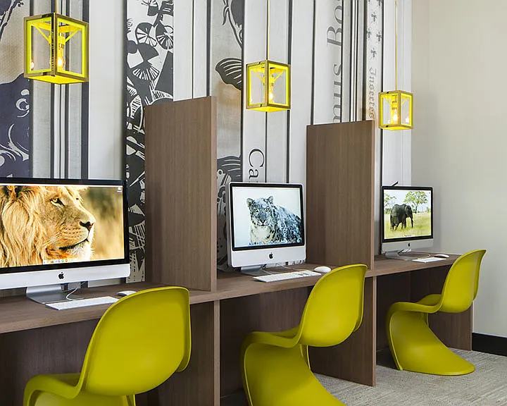 Apartment community business center with MAC work station at Griffis Belleview Station in Denver, Colorado.