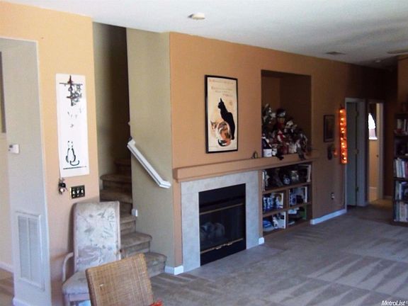 Just off the kitchen is the Family Room that connects most of the lower level.  Fireplace, Media Alcove, many windows allow for natural lighting.