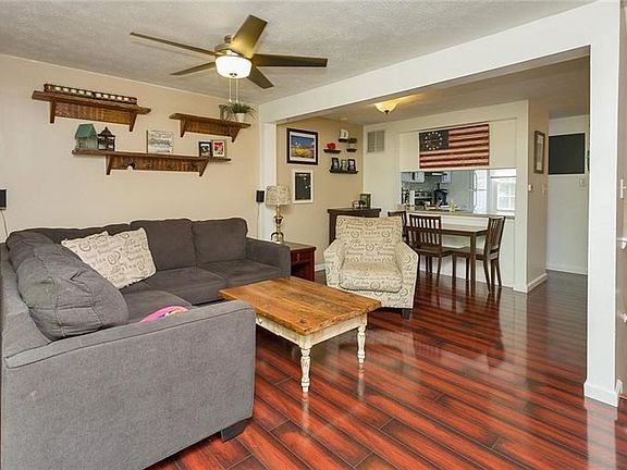 The main level offers a spacious open concept living room and dining room with pass through to the kitchen.