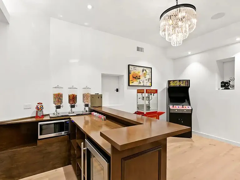 Mini bar with mini fridge, microwave and extra storage space for all of your fun time necessities