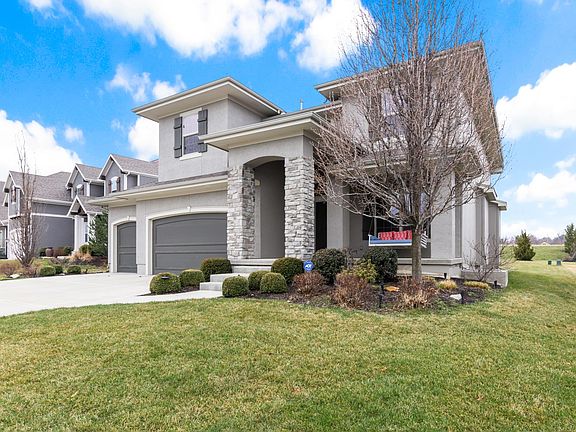 Exquisite front exterior, combining classic architecture with modern aesthetics. The tastefully landscaped front yard and welcoming entrance convey a sense of timeless sophistication, setting the tone for the entire residence.