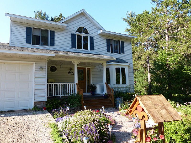 Perennial Flower garden in front. Attached 2 car garage.