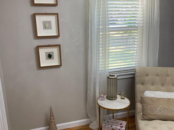 The second of the two main floor bedrooms. However was utilizes as a closet. The chase and marble table is for sale as the home will be rented empty unless renter wants to purchase furniture separately.