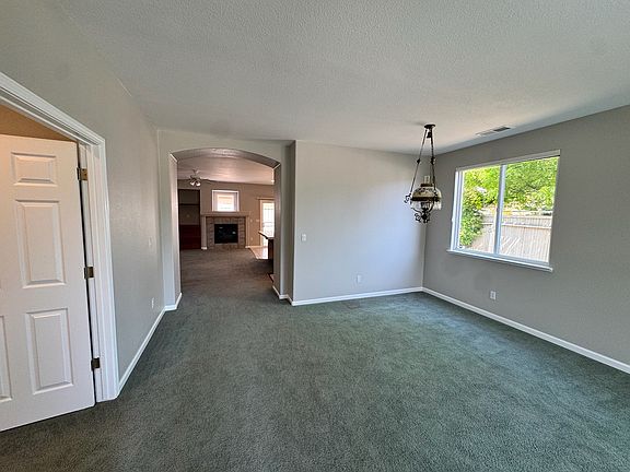 Front room with space for couches and dining table
