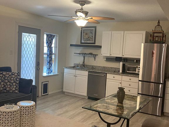 Living room area and kitchen.