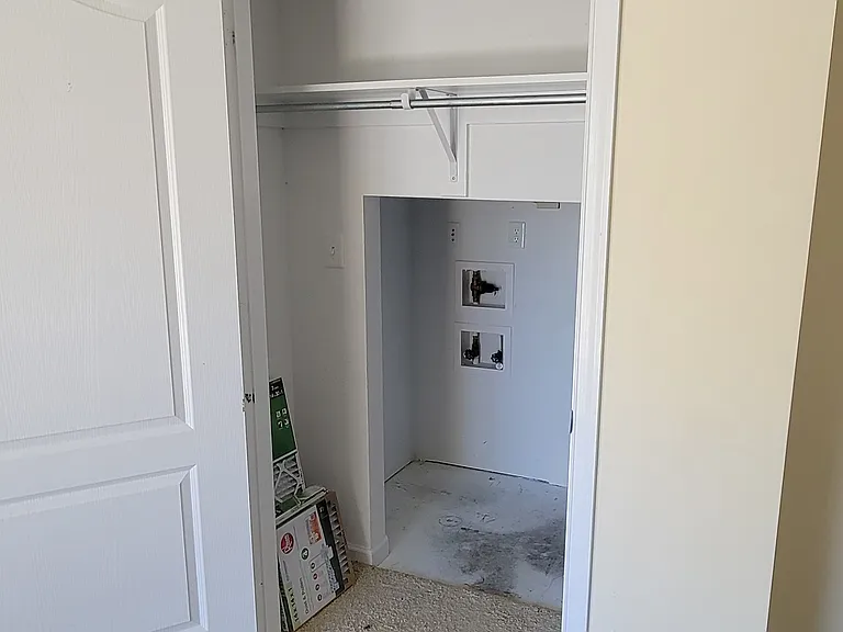Coat closet under stairs