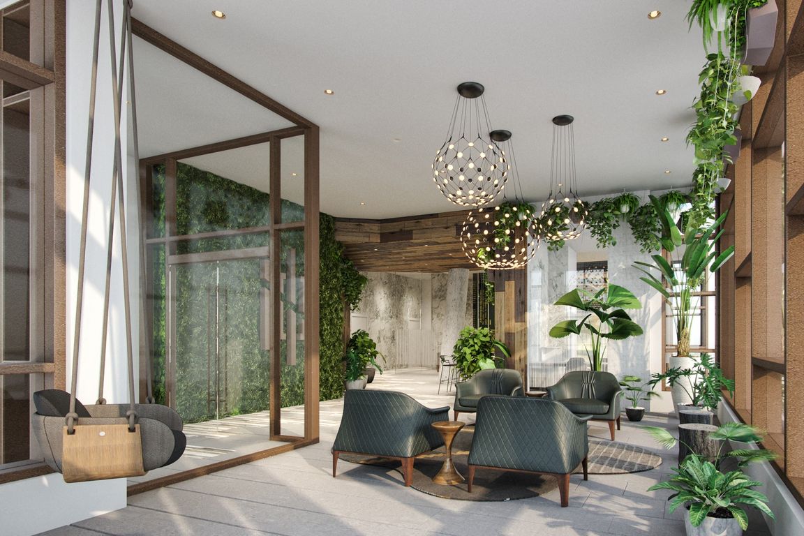 Welcoming lobby with a communal table for flexible work options or simply catching up with friends