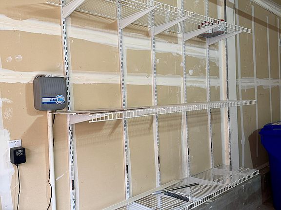 Garage with plenty of storage on both walls