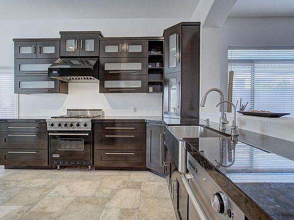 Kitchen with Viking oven and stove, stainless steel appliances.