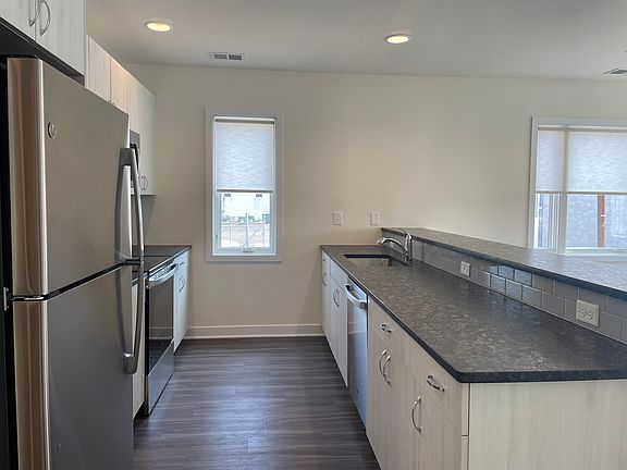 GE stainless steel appliances and large kitchen island