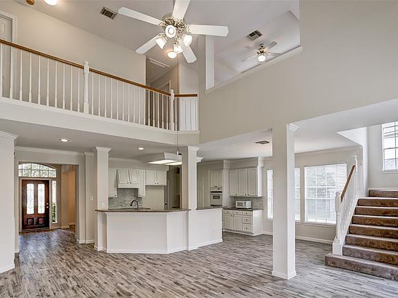 Open concept, two story design offers a seamless view from the kitchen to the main living area - great for entertaining, comfortable yet sophisticated.