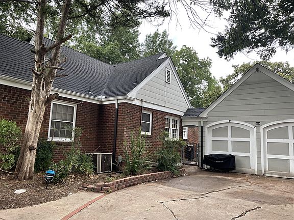 Detached garage would fit a small car, and the other side is workshop/storage.