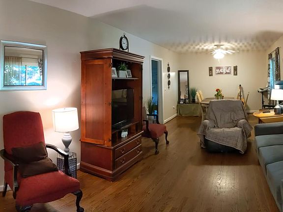 Living room with dining area next to the kitchen