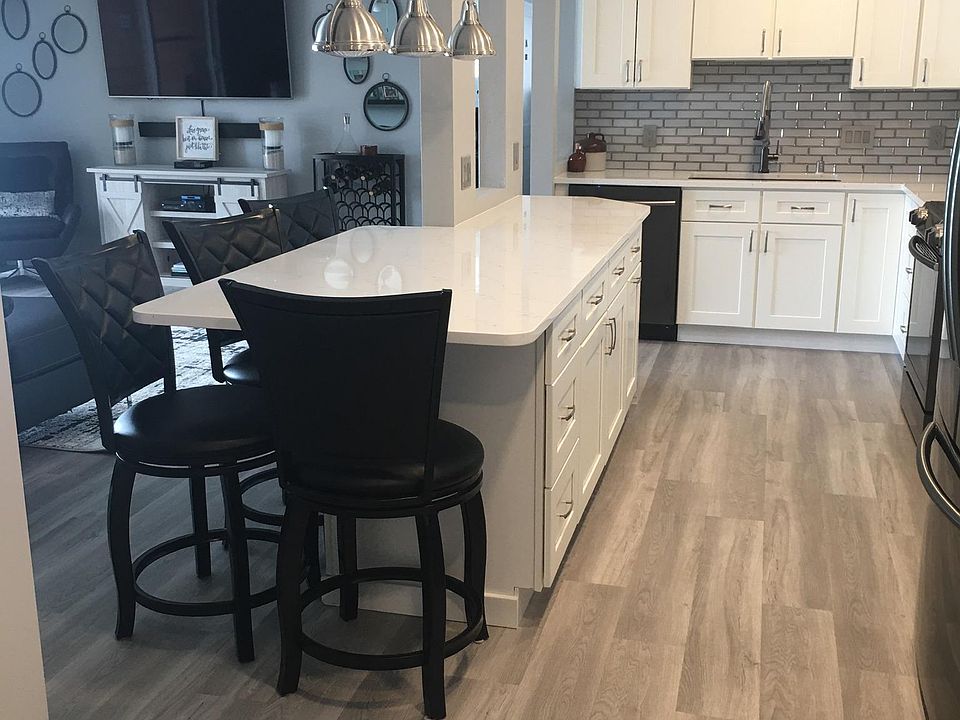 Kitchen is open to living room and looks out over lake Minnetonka
