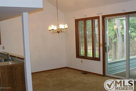 dining area with entrance to s porch