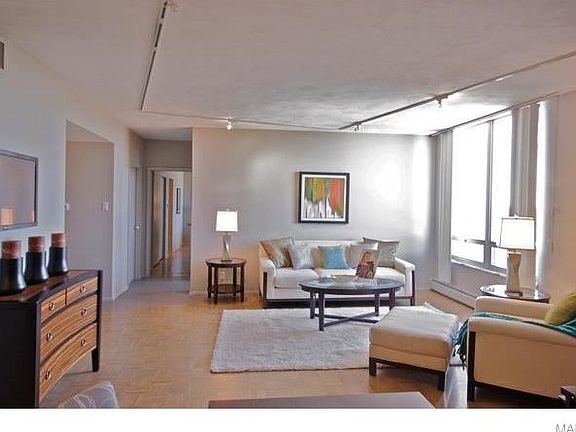 Living room has plenty of room for a dining table.  Window looks west with a gorgeous view.