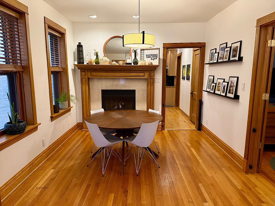 Dining room with working gas fireplace for cozy winter nights.