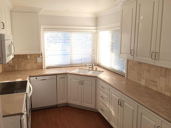 Kitchen includes granite countertops, dishwasher, microwave,