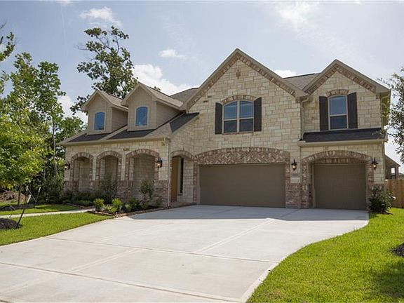 This fantastic home features a Stone & Brick Exterior with a lovely Covered Front Porch for great Cu