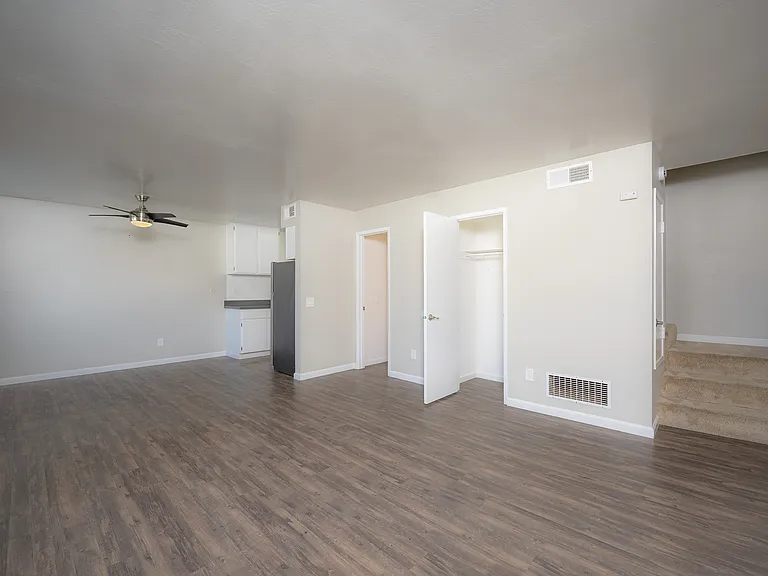 Embrace comfort in this sleek open-plan living space with a modern kitchen and ample natural light.