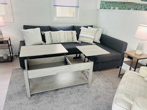 Cocktail table opens into two tray positions for dining or work space