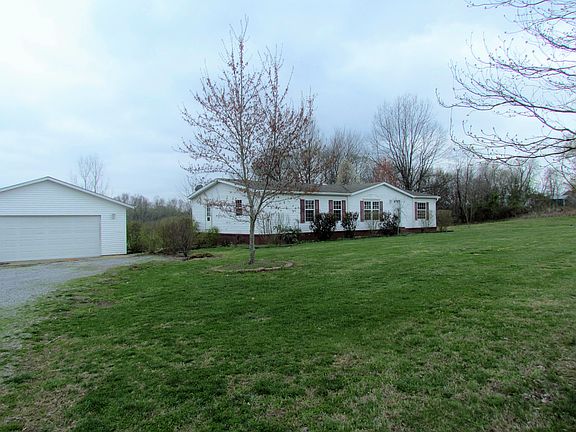 Left side of house and garag