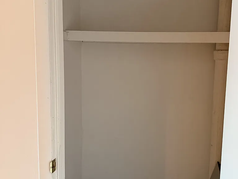 this is the largest closet or really a pantry that is next to the kitchen and dining area