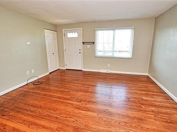 refinished hardwood, welcoming front entry with closet.