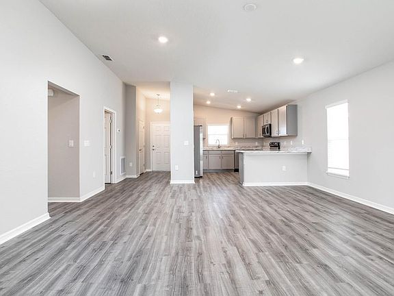 The kitchen is fully open to your spacious living area - New home for sale in Auburndale, FL