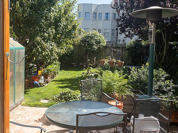 Back yard with lots of home grown fruits and vegetables to share.