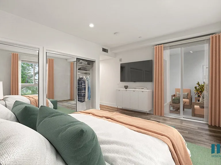 Bedroom with Two-Mirrored Closets and Patio