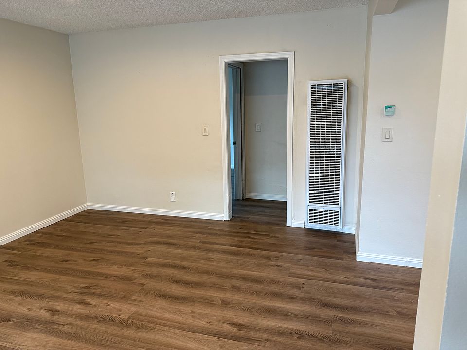 Living room view of hallway to bedrooms and bathroom