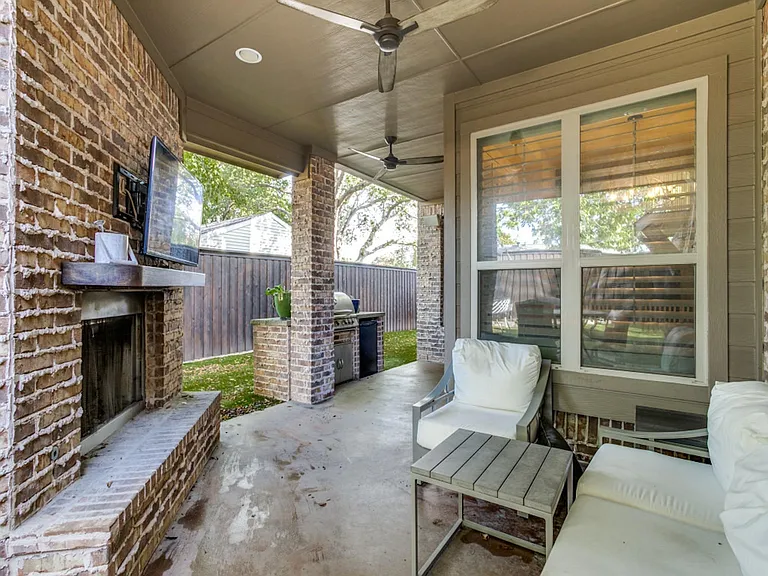 Covered Back Patio with Fireplace And Built-In Gas Grill