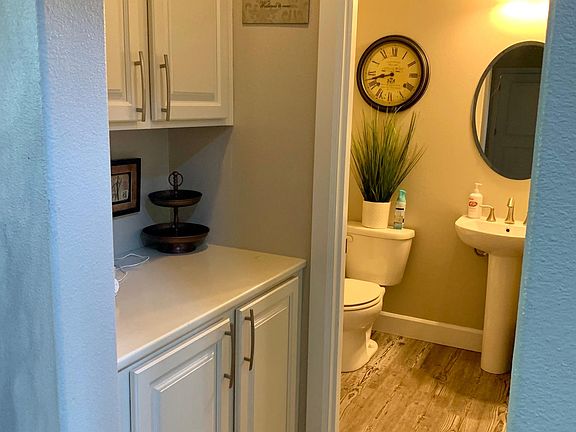 Downstairs toilette with lot of storage to the left.