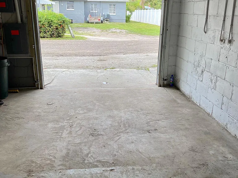 View walking into garage looking into alley