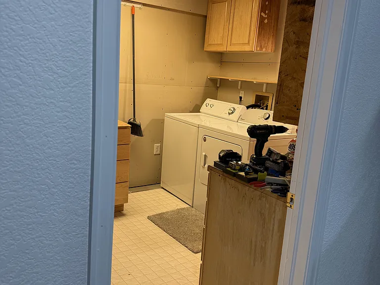 Laundry room with sink and extra storage