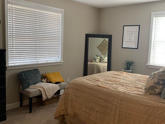 Master bedroom with walk-in custom closets and full master bathroom with walk-in shower