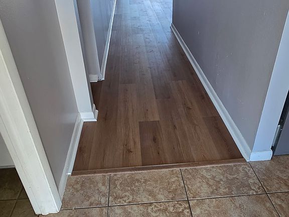 Hallway as you walk in the front door shown with the new decor