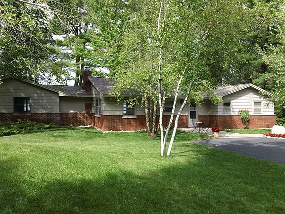 Front of house with driveway to left