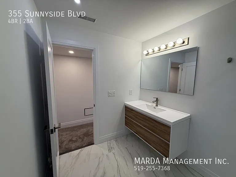 355 Sunnyside Blvd — Photo 57