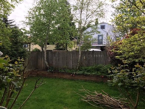 Private, fenced backyard. Alley access behind.