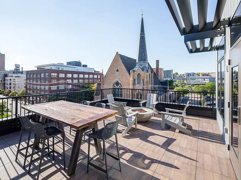 Rooftop deck with lounge seating and gas firepit