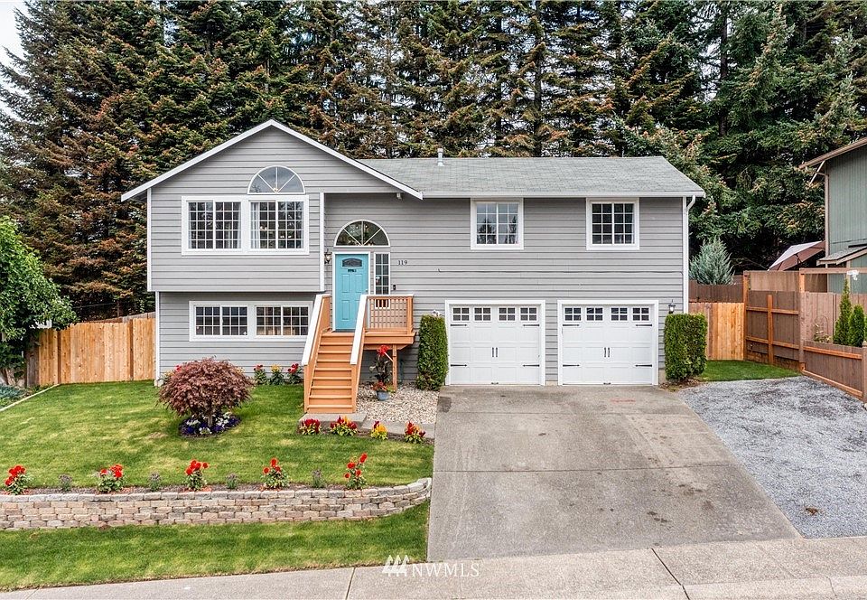 Great curb appeal with new sod and topsoil. Flowers include lavender, dahlias and black eyed susans. 
 Fresh new paint on front door and deck. Updated the front fence and added new parking to the right of the driveway.
