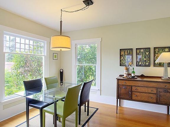 Bright, formal dining room with original and charming divided-light windows